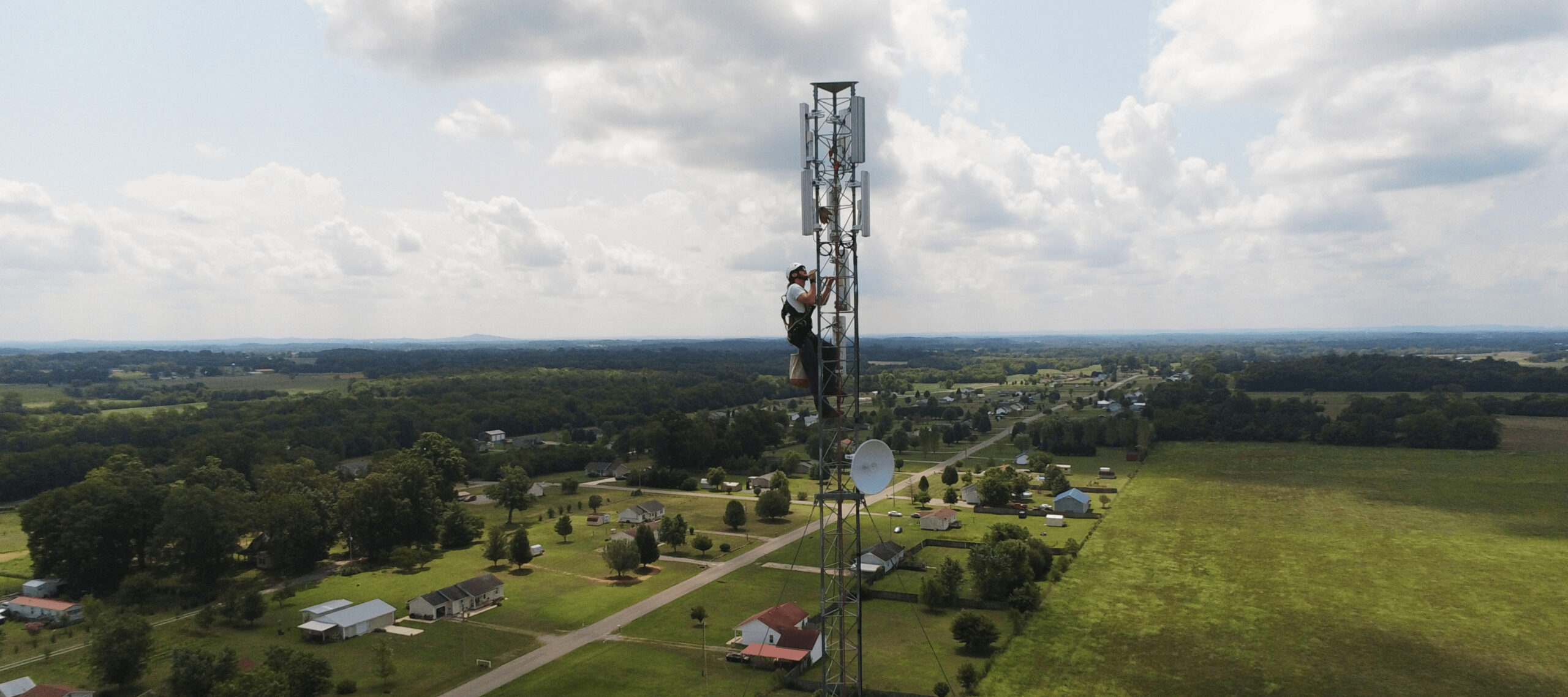 worker climbing a cell tower in Tennessee